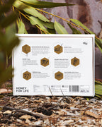 Honey for Life product packaging with honeycomb illustrations and text on a natural background