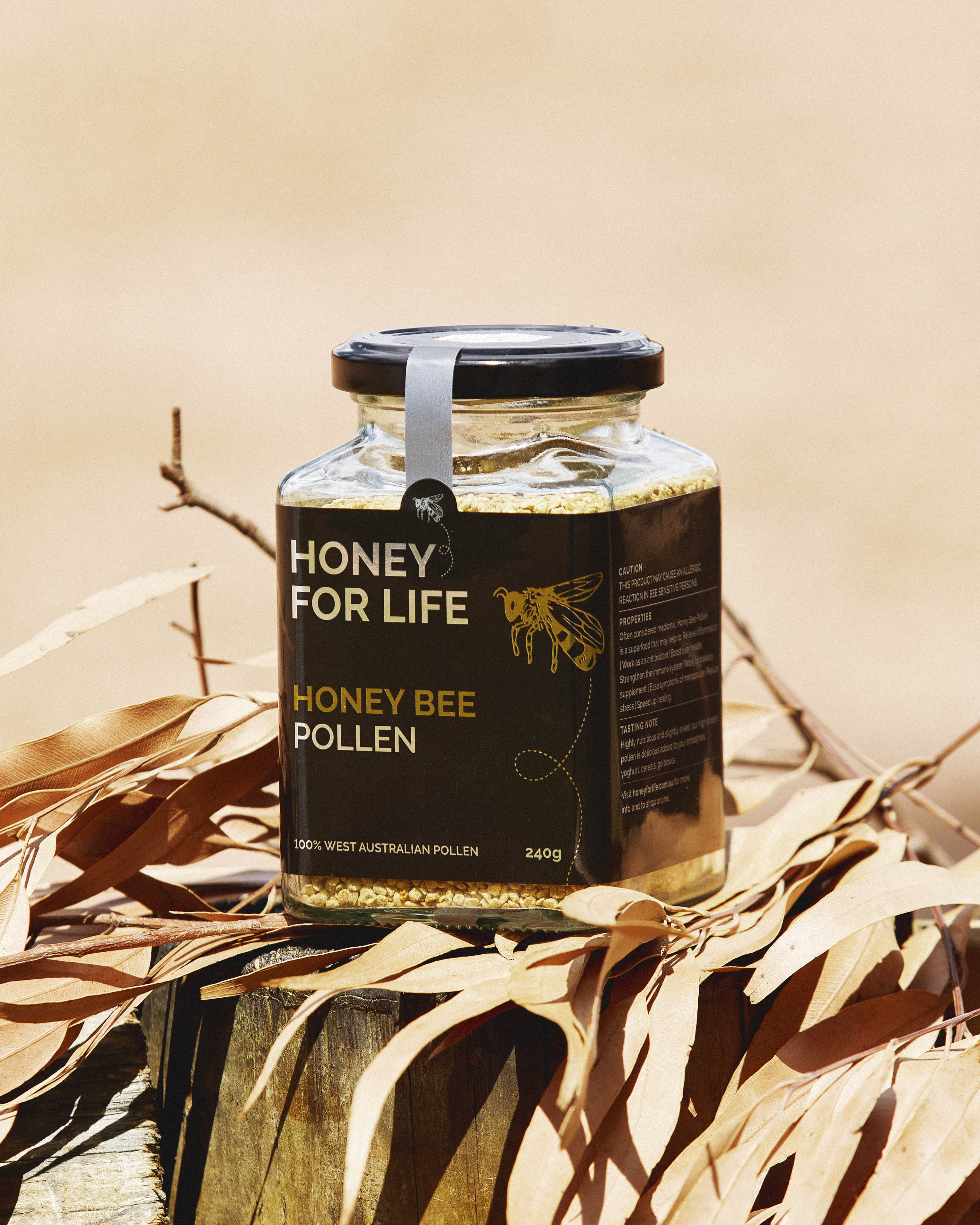 Jar of 'Honey for Life' honey bee pollen on a natural background
