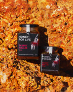 Two jars of 'Honey for Life' desert mallee honey on a textured rock background